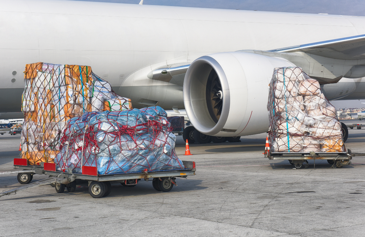 Freight pallets beside a cargo aircraft
