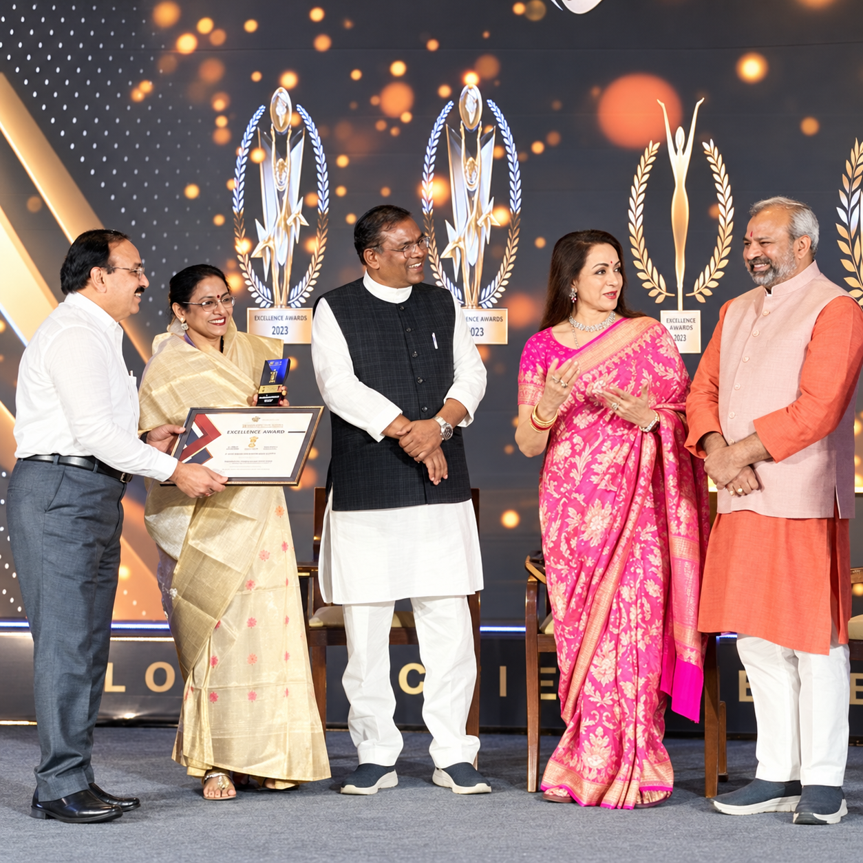 Excellence awards ceremony with participants receiving an award